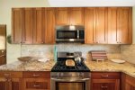 Granite countertops and stainless appliance